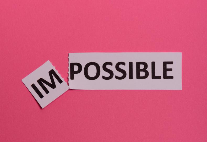 Paper saying impossible with the first 2 letters torn off