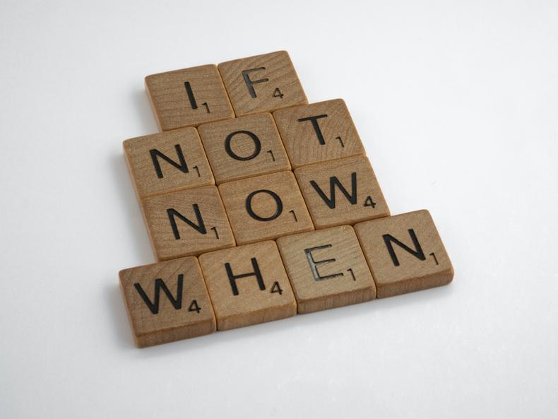 wooden blocks spelling 'if not now when'